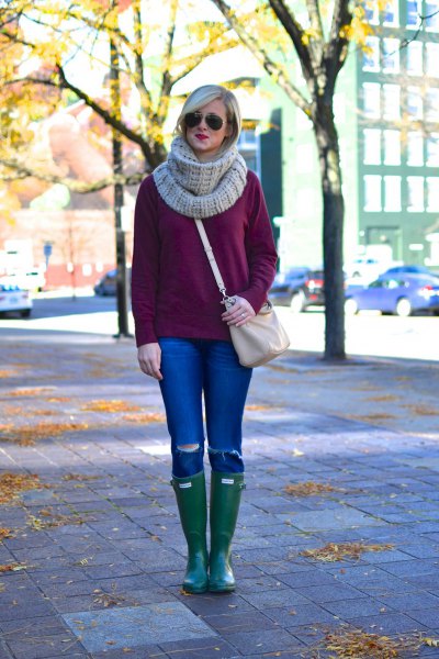 Chunky knit sweater with gray scarf and knee high leather boots