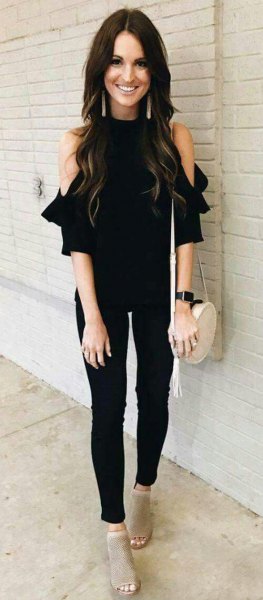 Black cold-shoulder blouse, skinny trousers and gray short open-toe boots