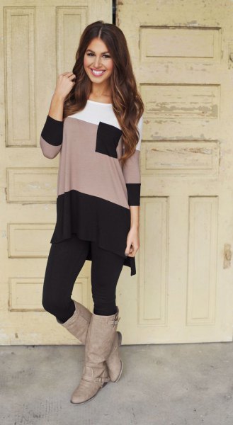 Long color block t-shirt with black leggings and gray leather boots