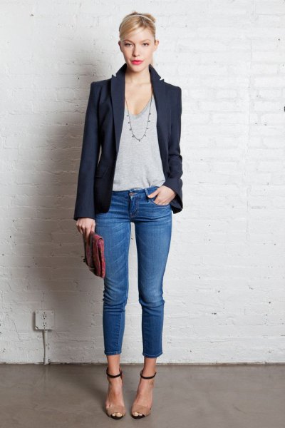 Dark blazer with gray plunging scoop neck t-shirt and cropped
jeans