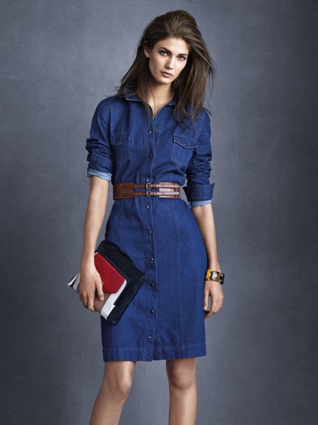 Dark blue buttoned mini denim dress with belt and black and brown clutch