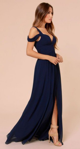 Dark blue strapless maxi dress with a deep V-neckline and a high slit