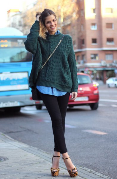 Dark green cable knit sweater with blue button down chambray shirt
