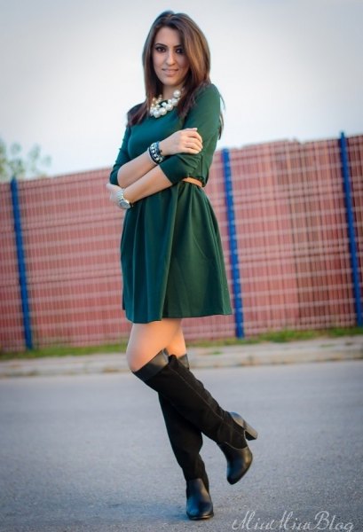 dark green dress with black knee high boots