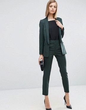 Dark green suit with a black t-shirt and pointed heels