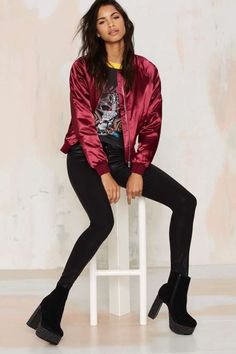 Dark red bomber jacket with black printed t-shirt and skinny jeans