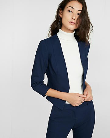 deep blue blazer with matching chinos and white stand-up collar sweater