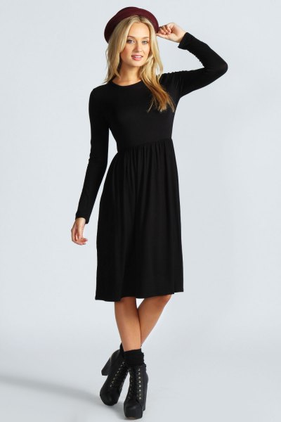Felt hat with black long sleeve flared midi dress and heeled boots