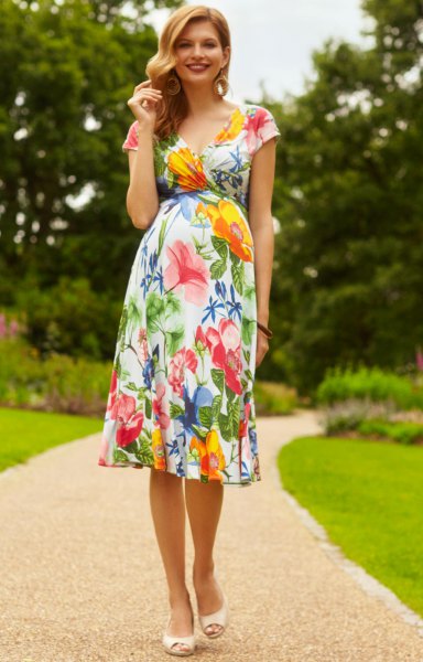 Midi length Hawaiian wedding dress with a floral pattern and a flared silhouette