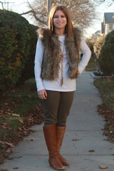 Fur vest with white long sleeve t-shirt and brown leather knee high boots