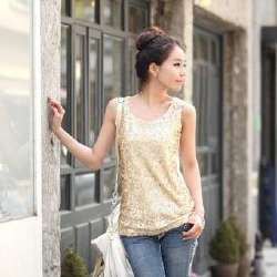 gold sequin tank top with white leather handbag