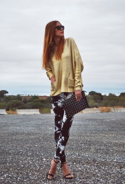 gold sweater with black and white tie-dye leggings and open heels