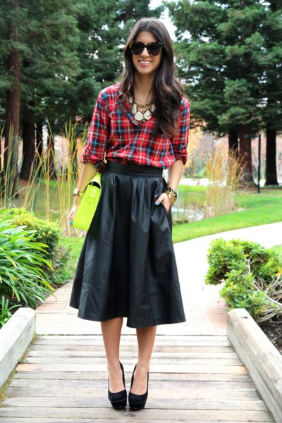 green and blue checked shirt with black flared midi leather skirt