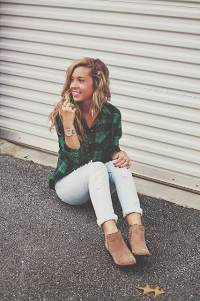 green and blue checked shirt with white cuffed jeans