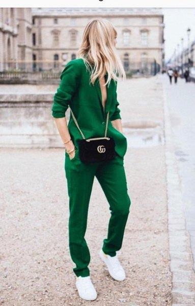 Green blazer with matching trousers and white sneakers