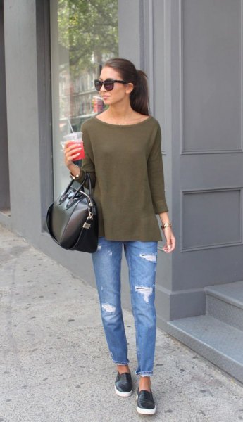 Green boat neck blouse and blue ripped slim fit jeans