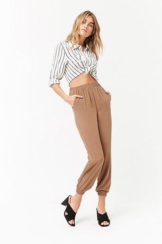 Gray and white vertical striped knotted button down shirt and green trousers