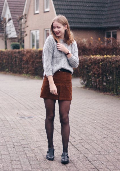 gray cable knit sweater with dark brown mini skirt