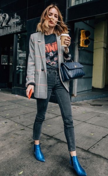 gray checked blazer with black printed t-shirt and blue leather boots