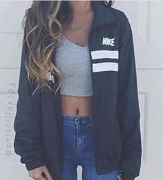 gray crop top with oversized windbreaker and blue high waisted skinny jeans