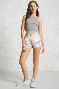 Gray cropped ribbed tank top paired with cream mini shorts