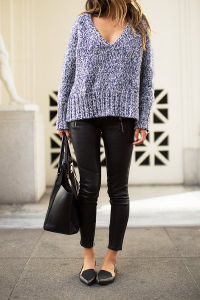 Gray chunky knit sweater with a deep V-neck, leather pants and black pointed ballerinas