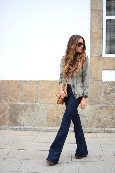 gray denim jacket with a striped t-shirt and dark blue, low-rise flared jeans