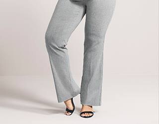 Gray suit pants with black ankle straps and open toe heels