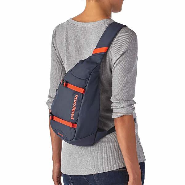 grey, fitted long-sleeved T-shirt with a purple shoulder bag
