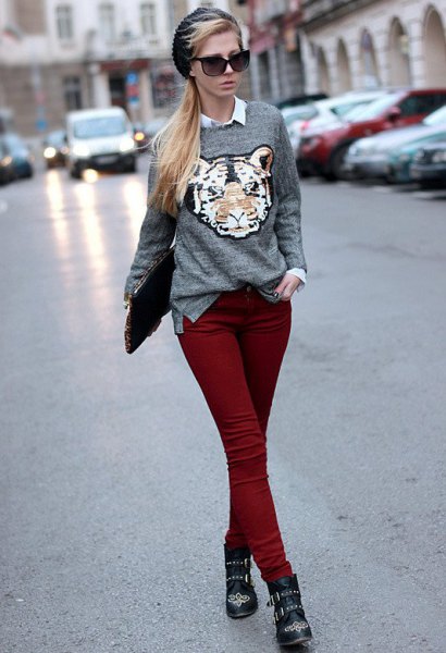 gray graphic sweater with white button down shirt and maroon skinny jeans