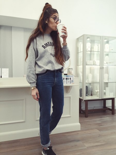 Gray graphic sweatshirt with blue cuffed mom jeans
