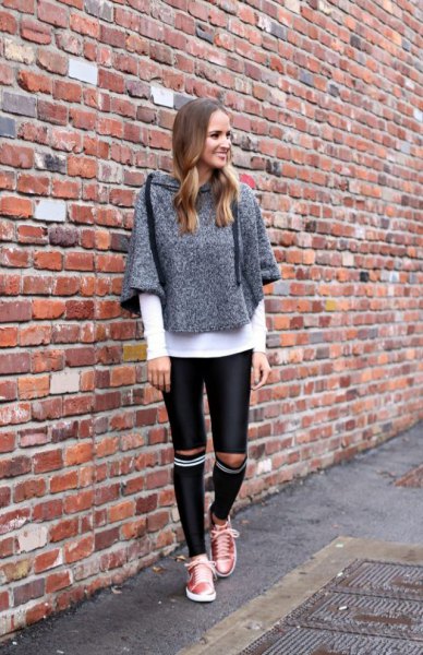 Heather gray sweater with black leather knee-length skinny pants