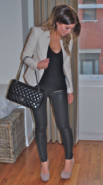 gray jacket with scoop neck tank top and leather pants