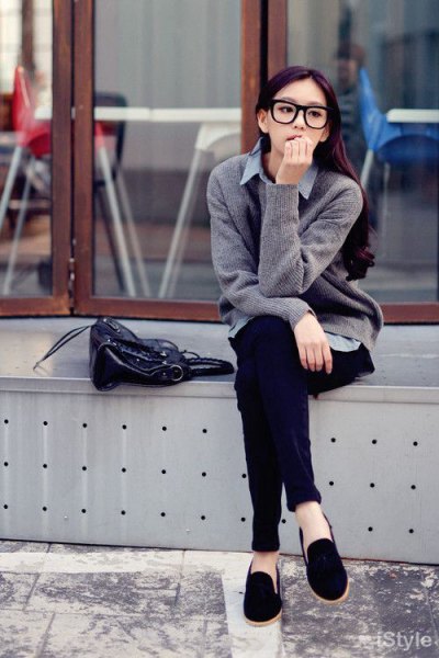 Gray knit sweater with light blue chambray shirt and black suede loafers