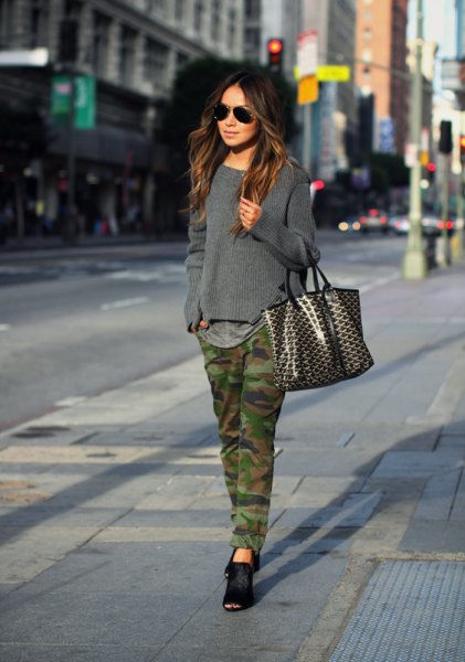 gray knit sweater with straight leg camo jeans and black ballet
flats