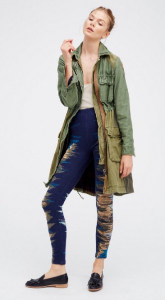 gray long military jacket with dark blue printed leggings and loafers