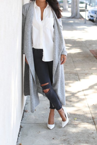Gray long knit cardigan with white shirt and ripped jeans