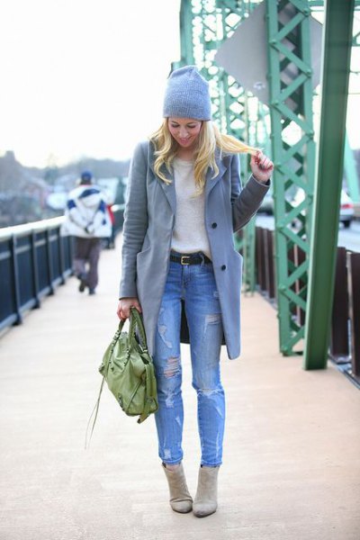 gray long wool coat with light blue ripped slim fit jeans