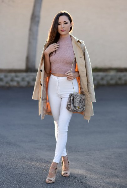 Gray fitted cropped turtleneck sweater paired with white skinny jeans