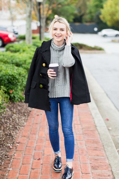 gray knit sweater with high neck and black double-breasted wool coat