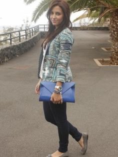Gray printed blazer with blue leather clutch