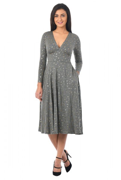 Gray printed jersey knit dress with a deep V-neckline and a flared silhouette