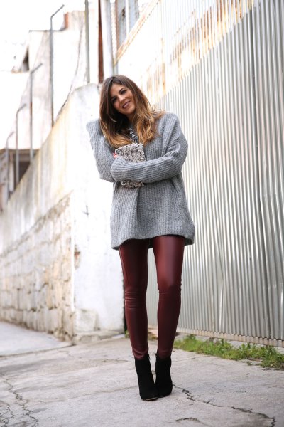 Gray ribbed bulky sweater with burgundy leather leggings