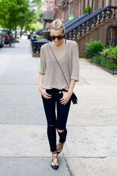 Gray semi-sheer sweater with black ripped jeans and strappy flat shoes
