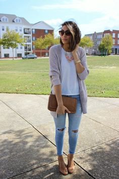 Gray sweater cardigan with white t-shirt and light blue ripped skinny jeans