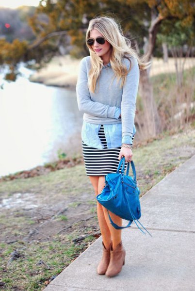 gray sweater with light blue chambray shirt and black and white striped dress