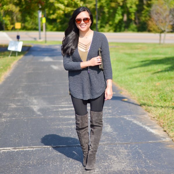 gray sweater with thigh-high suede zip-up boots