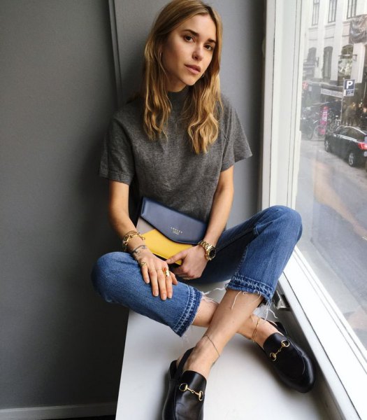 gray t-shirt with blue cropped jeans and leather slip-on loafers