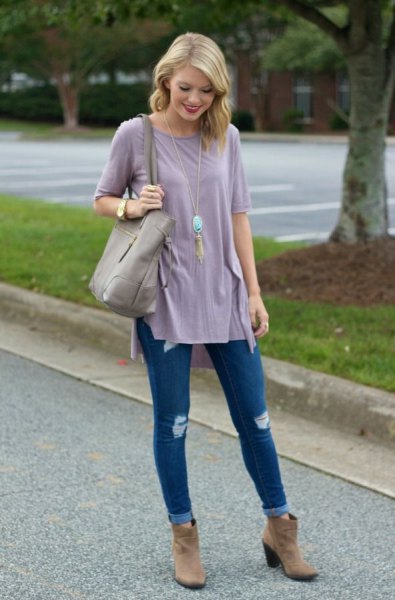 Gray tunic t-shirt with blue ripped skinny jeans and brown suede ankle boots