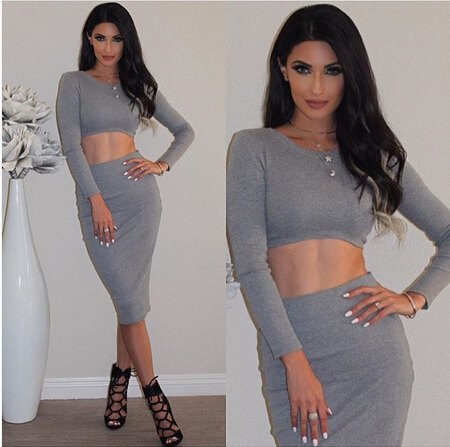 Gray two-piece, figure-hugging mini dress with black strappy sandals
